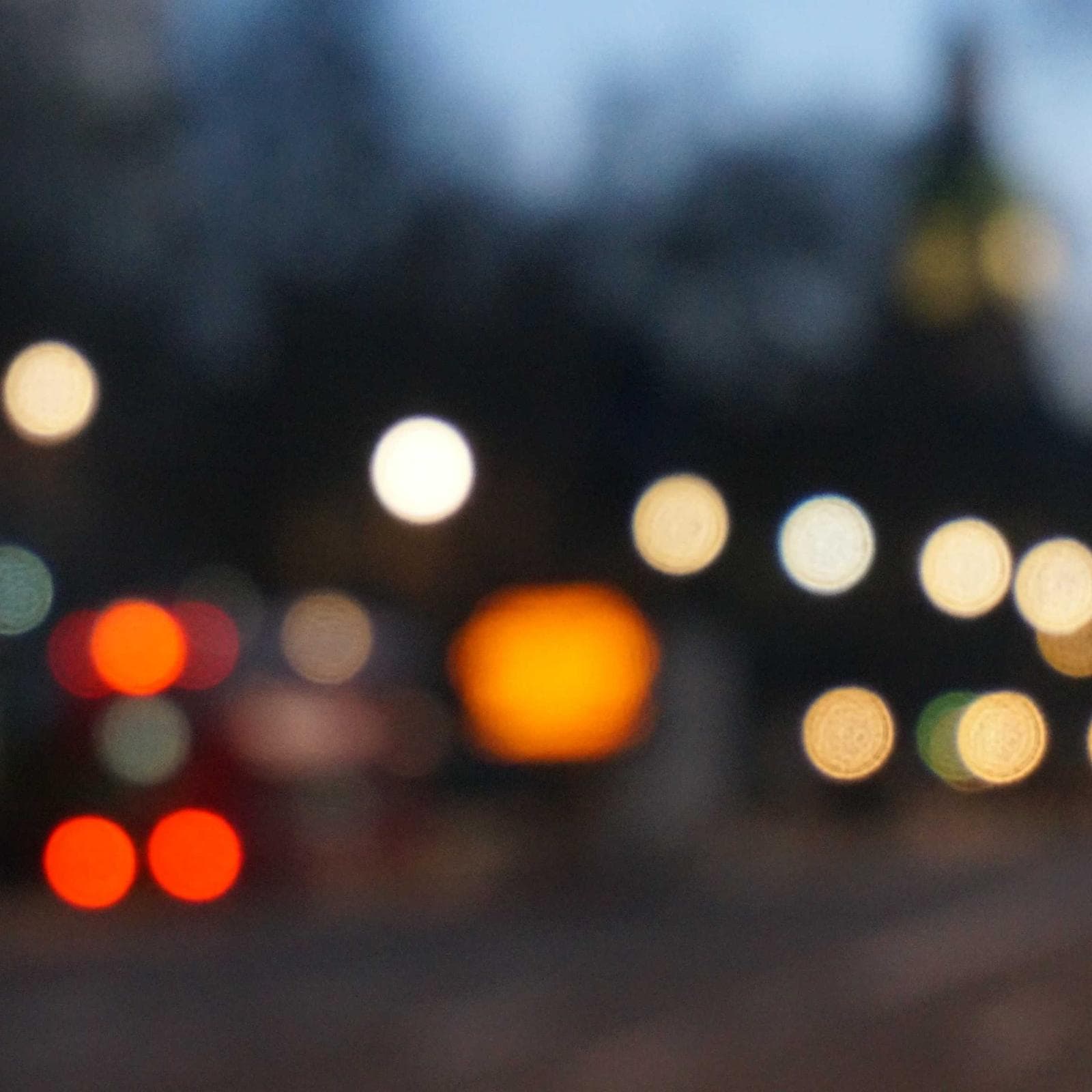 Out-of-focus city lights glowing at dusk